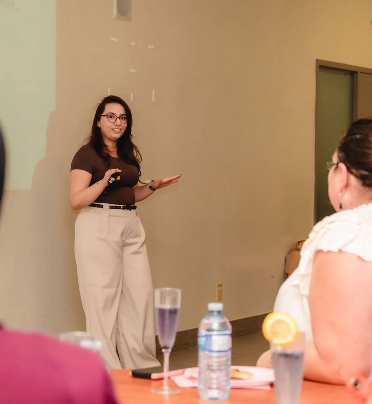 Nadeje Tabib smiling and gesturing while teaching an AI workshop
